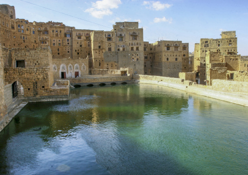 Traditional houses in front of a water cistern, Amran Governorate, Hababah, Yemen