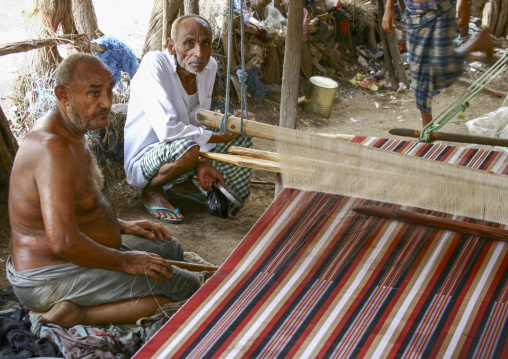 Yemeni men weaving in a workshop, Al Hudaydah Governorate, Zabid, Yemen