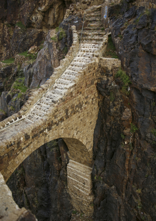 The Shahara bridge over a rocky gorge, Amran Governorate, Shaharah, Yemen