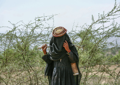 Yemeni veiled girl with a hat, Amran Governorate, Shaharah, Yemen