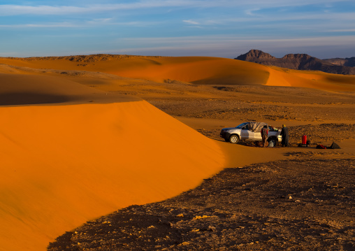 Tourists camps near a sand dune in the Sahara desert, Tassili N'Ajjer National Park, Tadrart Rouge, Algeria