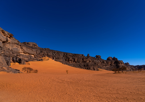 Rocks and sand dunes in Sahara desert, Tassili N'Ajjer National Park, Tadrart Rouge, Algeria