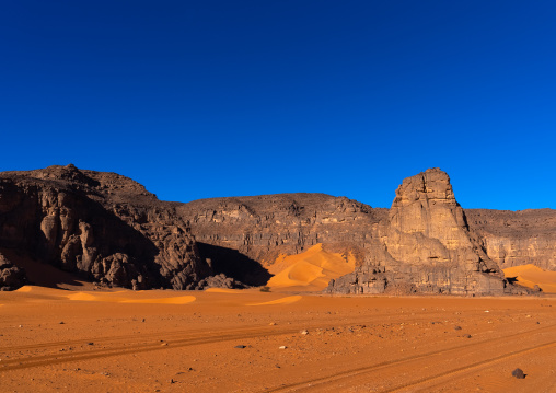 Rocks and sand dunes in Sahara desert, Tassili N'Ajjer National Park, Tadrart Rouge, Algeria