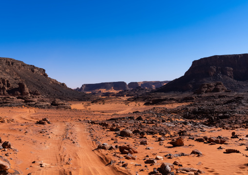 Rocks and sand dunes in Sahara desert, Tassili N'Ajjer National Park, Tadrart Rouge, Algeria