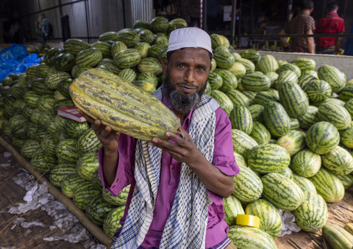 Bangladeshi man selling watermelons at Kawran Bazar market, Dhaka Division, Dhaka, Bangladesh