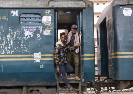 Passengers in a train passing in Kawran bazar, Dhaka Division, Dhaka, Bangladesh
