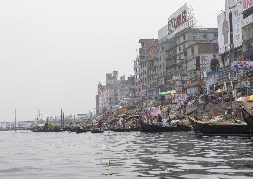 Local boats and buildings on the Buriganga river bank, Dhaka Division, Keraniganj, Bangladesh