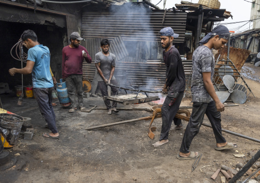 Bangladeshi workers melting steel at Dhaka Shipyard, Dhaka Division, Keraniganj, Bangladesh