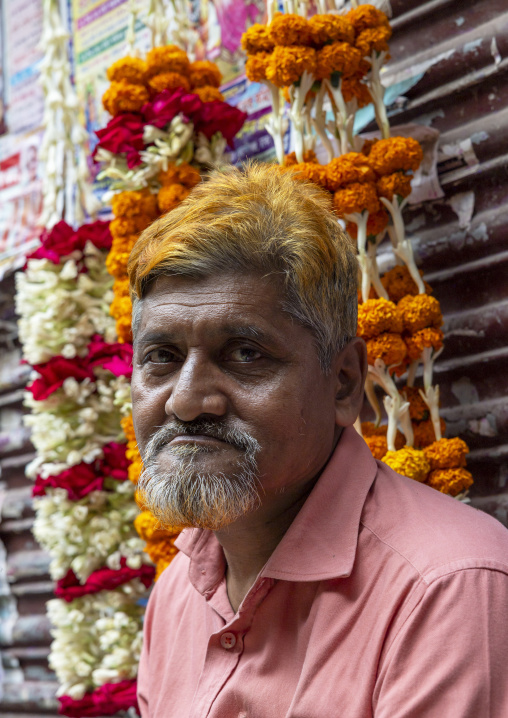 Bangladeshi man with a hair dyed in henna in flower market, Dhaka Division, Dhaka, Bangladesh