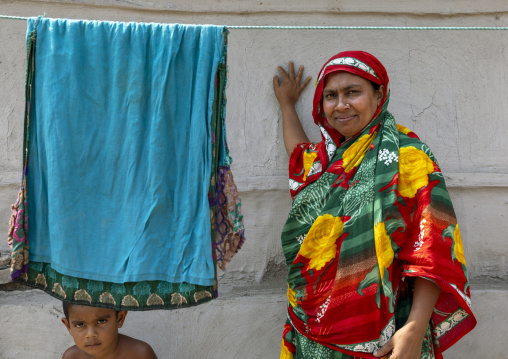 Portrait of a veiled woman with her son, Khulna Division, Shyamnagar, Bangladesh