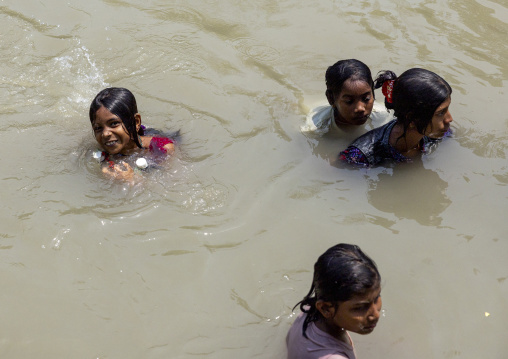 Bangladeshi girls cooling down in a river in Sundarbans, Khulna Division, Narail Sadar, Bangladesh