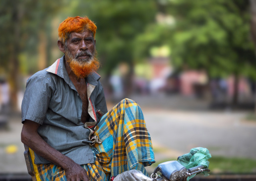 Portrait of a bangladeshi man with a beard dyed in henna, Khulna Division, Jessore, Bangladesh