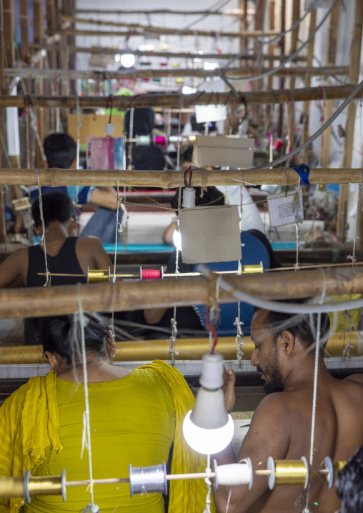 Bangladeshi people weaving in a sari factory, Dhaka Division, Rupganj, Bangladesh