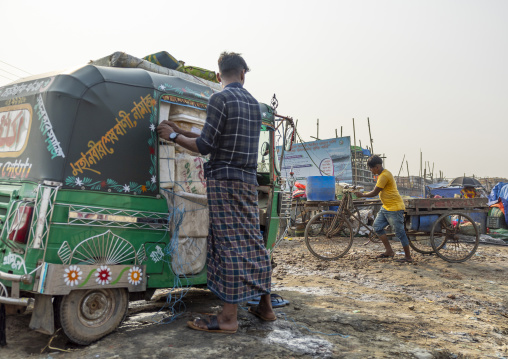 Rickshaws in the morning fish market, Chittagong Division, Chittagong, Bangladesh
