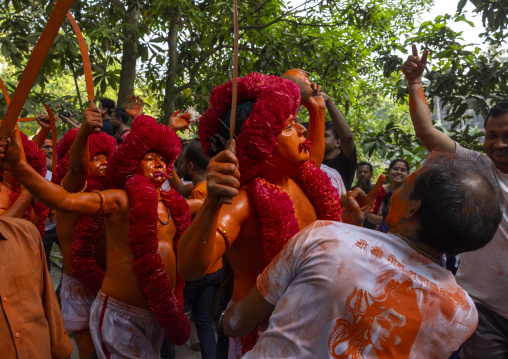 Hindu devotees covered with orange color in Lal Kach festival, Dhaka Division, Munshiganj Sadar, Bangladesh
