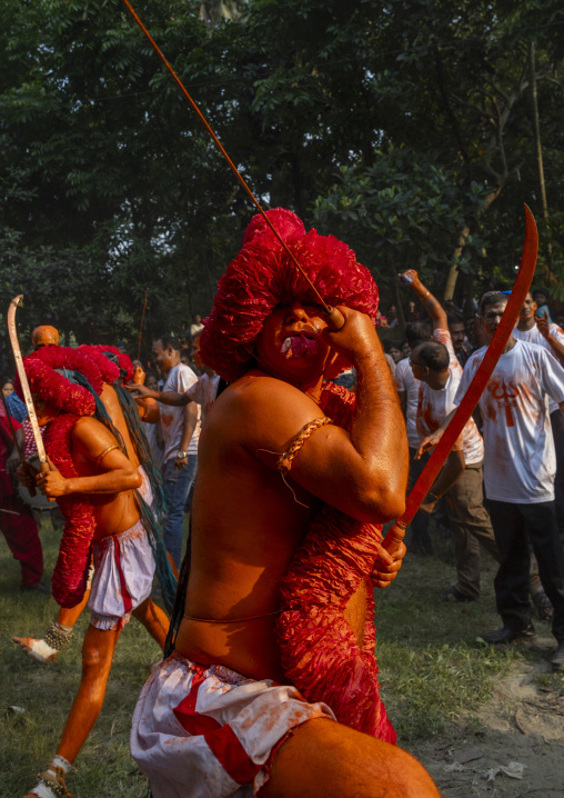 Hindu devotees covered with orange color in Lal Kach festival, Dhaka Division, Munshiganj Sadar, Bangladesh