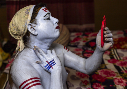 Make up of a hindu devotee who becomes Lord Shiva at Lal Kach festival, Dhaka Division, Munshiganj, Bangladesh