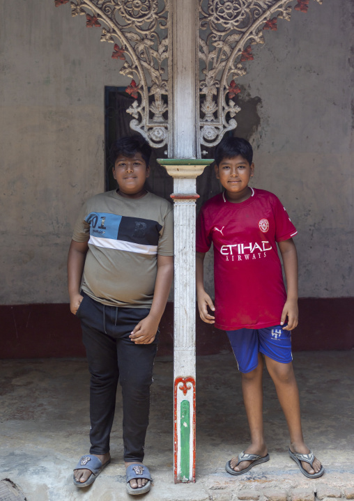 Bangladeshi boys under ornate Ironwork, Dhaka Division, Munshiganj, Bangladesh