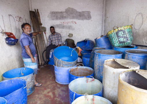 Bangladeshi men in a workshop at fish market, Chittagong Division, Chittagong, Bangladesh