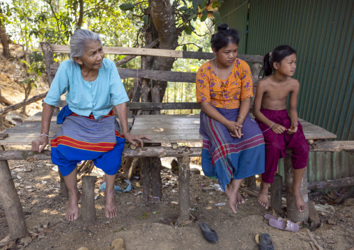 Tanchangya ethnic group women sit on a bench in the street, Chittagong Division, Bandarban, Bangladesh