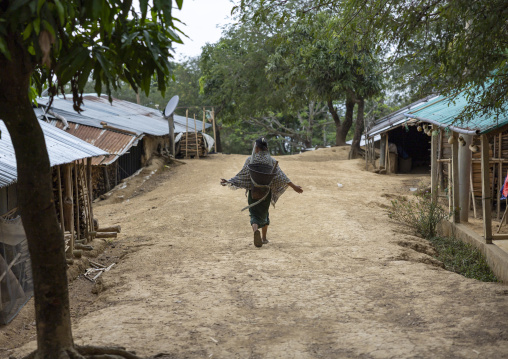 Murong ethnic group woman walking in a village, Chittagong Division, Bandarban, Bangladesh