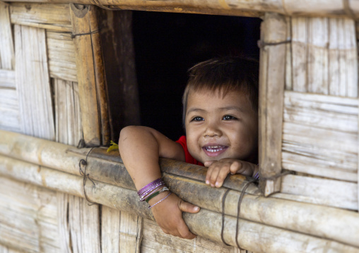 Murong ethnic group girl in the window of a bamboo house, Chittagong Division, Bandarban, Bangladesh