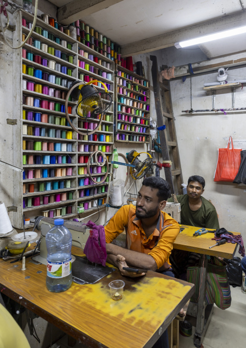 Bangladeshi men sewing inside the market, Dhaka Division, Dhaka, Bangladesh