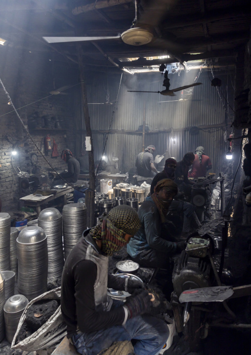Bangladeshi workers making metal bowls, Dhaka Division, Dhaka, Bangladesh