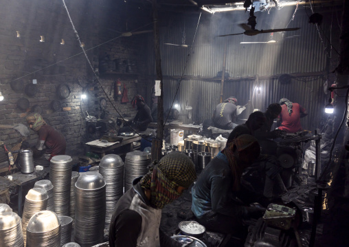 Bangladeshi workers making metal bowls, Dhaka Division, Dhaka, Bangladesh