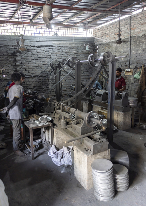 Bangladeshi workers making metal bowls, Dhaka Division, Dhaka, Bangladesh