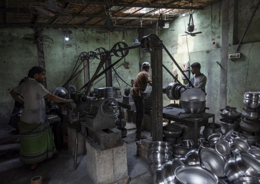 Bangladeshi workers making metal bowls, Dhaka Division, Dhaka, Bangladesh