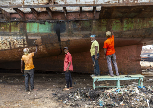 Workers at Dhaka Shipyard removing rust, Dhaka Division, Keraniganj, Bangladesh