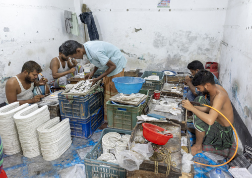Metal worker using old lost wax casting method to create jewels, Dhaka Division, Dhamrai, Bangladesh