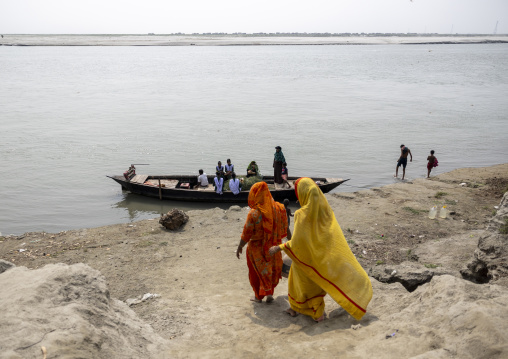 Bangladeshi women going to take a canoe to cross the river, Dhaka Division, Shivalaya, Bangladesh