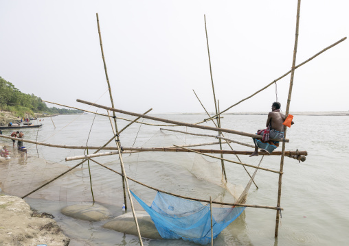 Traditional fishing net which functions on the principle of balance, Dhaka Division, Shivalaya, Bangladesh