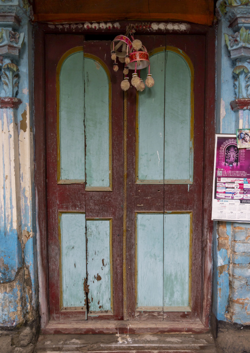 Door in an Hindu temple with mobile ornaments to  bring good fortune, Rajshahi Division, Bogura, Bangladesh