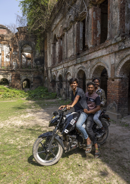 Bangladeshi young men on motorbike inside Dinajpur Rajbari ruins, Rajshahi Division, Dinajpur, Bangladesh