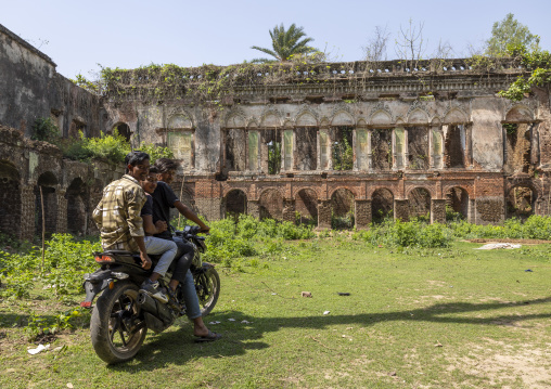 Bangladeshi young men on motorbike inside Dinajpur Rajbari ruins, Rajshahi Division, Dinajpur, Bangladesh
