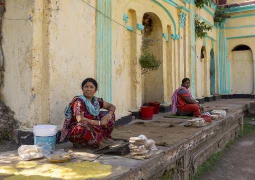 Women selling food inside Hindu temple in Dinajpur Rajbari complex, Rajshahi Division, Dinajpur, Bangladesh