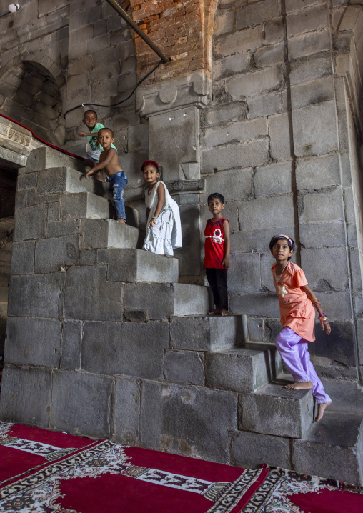 Children on the stairs of the Kusumba Mosque, Rajshahi Division, Kusumba, Bangladesh