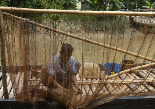 Bangladeshi fishermen use otters to fish in the Sundarbans, Khulna Division, Narail, Bangladesh