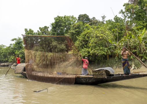 Bangladeshi fishermen use otters to fish in the Sundarbans, Khulna Division, Narail, Bangladesh