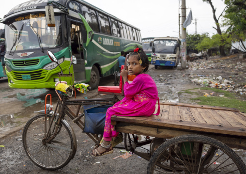 Portrait of a bangladeshi girl sit on a tricycle, Khulna Division, Mongla, Bangladesh
