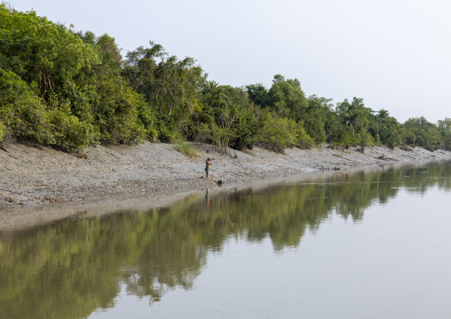 Fisherman casting out fishing net, Khulna Division, Mongla, Bangladesh