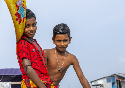 River gypsy boys living on a boat, Barisal Division, Barisal, Bangladesh