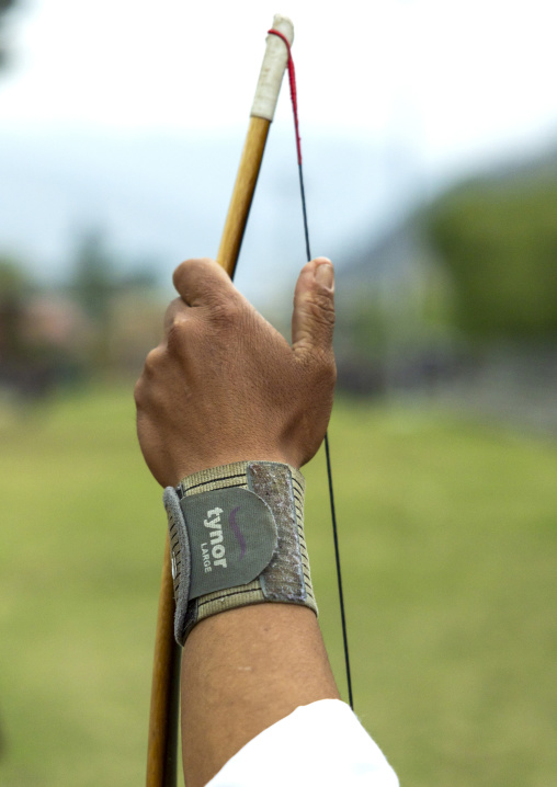 Bhutanese archer hand on an archery range, Chang Gewog, Thimphu, Bhutan