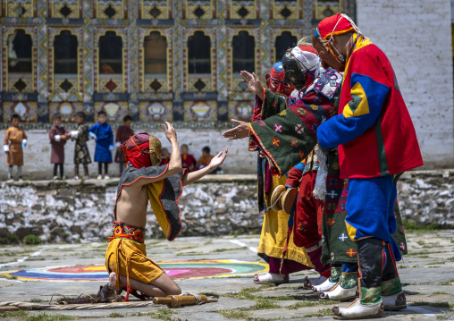Masked atsaras at the annual Ura Yakchoe festival, Bumthang, Ura, Bhutan
