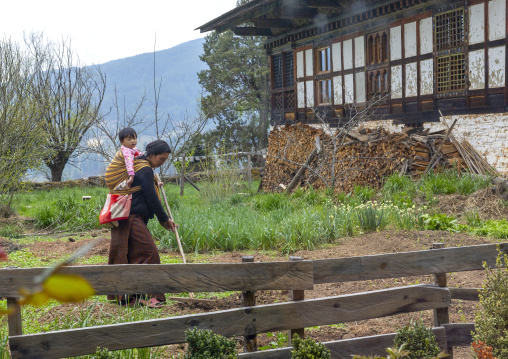 Woman working in the organic garden of Ogyen Choling Palace, Bumthang, Ogyen Choling, Bhutan