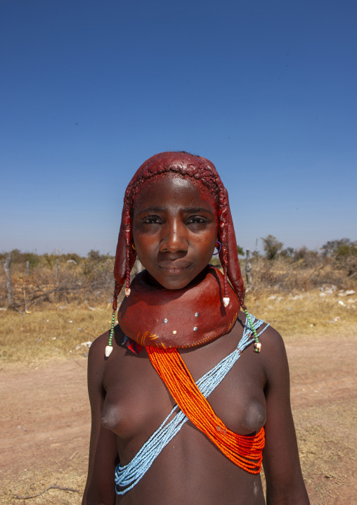 Mumuhuila tribe teenage girl wearing a huge necklace, Huila province, Chibia, Angola