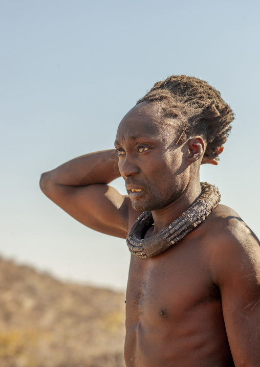Himba tribe man with the traditional necklace, Cunene province, Oncocua, Angola